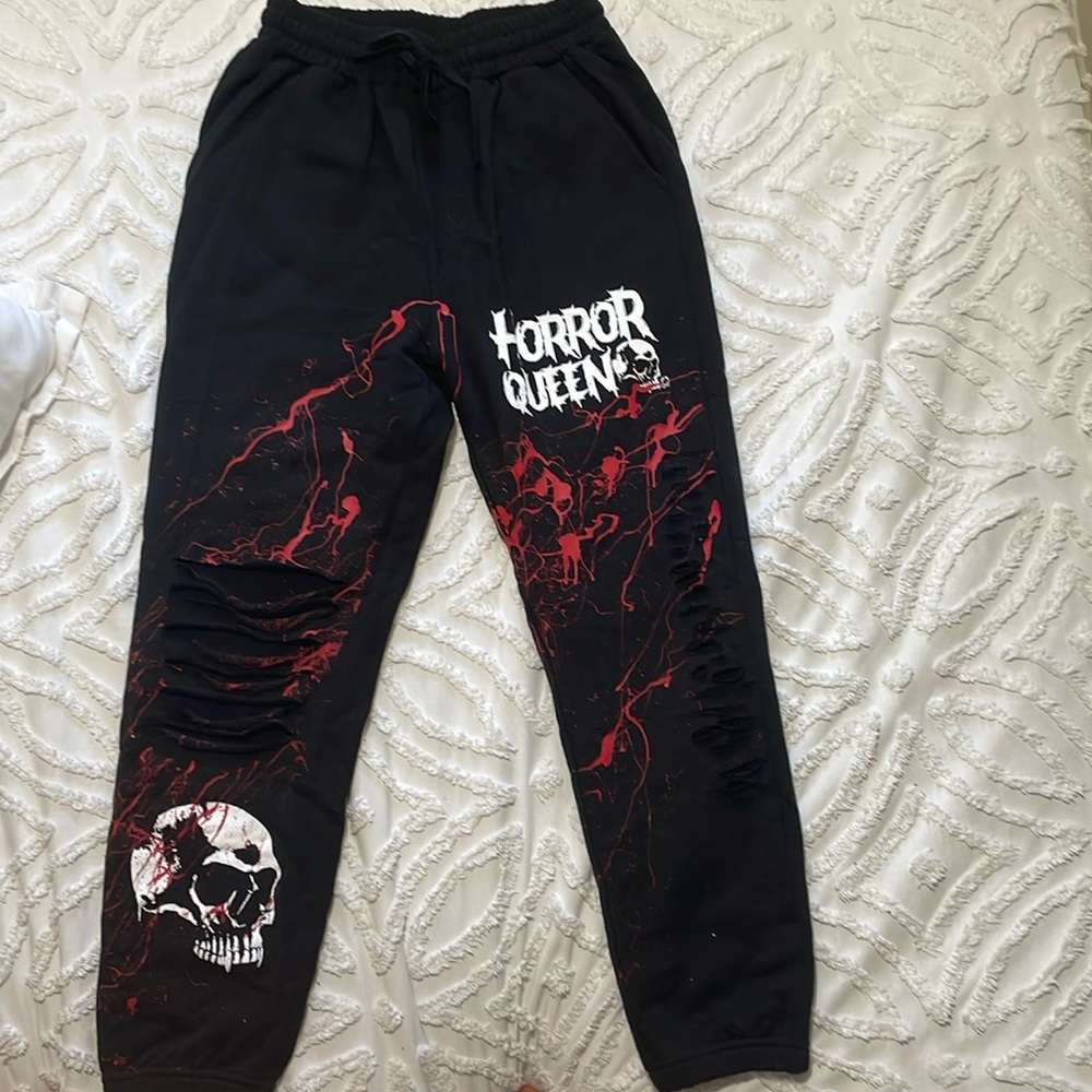 Sweatpants, black and red M fits as L. NEVER WORN, LIMITED EDITION.